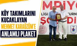 KÖY TAKIMLARINI KUCAKLAYAN MEHMET KARAÜZÜM’E ANLAMLI PLAKET