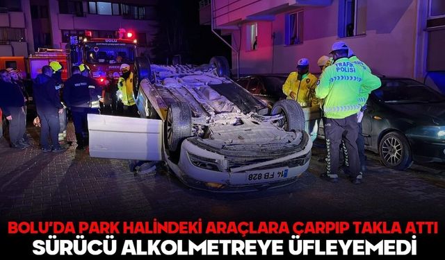 BOLU’DA PARK HALİNDEKİ ARAÇLARA ÇARPIP TAKLA ATTI: SÜRÜCÜ ALKOLMETREYE ÜFLEYEMEDİ